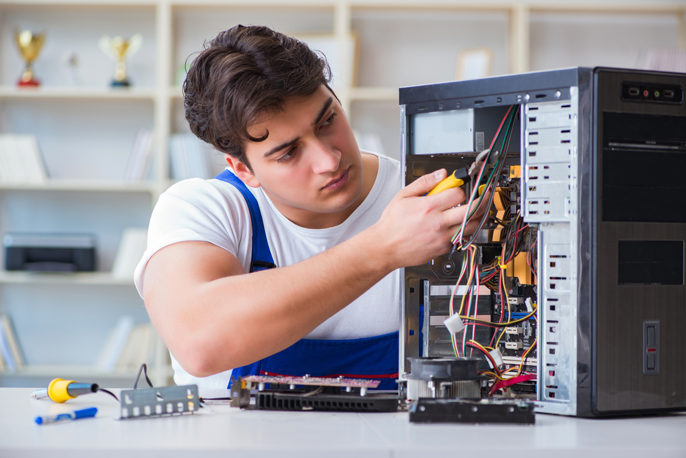 United Smart Tech technician working on computer hardware